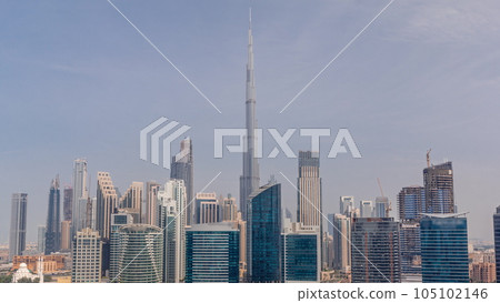 Aerial view to Dubai Business Bay and Downtown with the various skyscrapers and towers timelapse 105102146