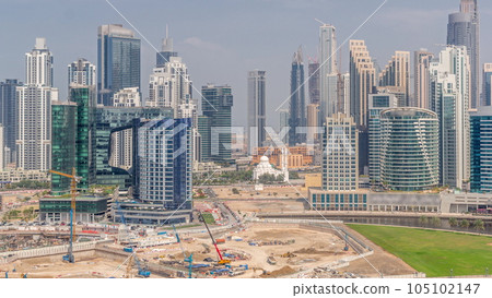 Cityscape with skyscrapers of Dubai Business Bay and water canal aerial timelapse. 105102147