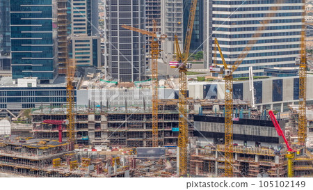 Large construction site with many working cranes timelapse. 105102149