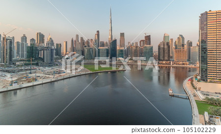 Aerial view to Dubai Business Bay and Downtown with the various skyscrapers and towers timelapse 105102229