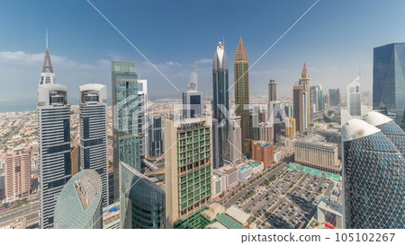 Pamorama showing skyline view of the high-rise buildings on Sheikh Zayed Road in Dubai aerial timelapse, UAE. 105102267