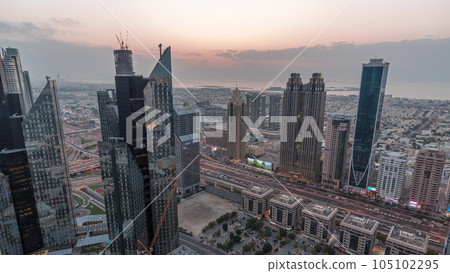 High-rise buildings on Sheikh Zayed Road in Dubai aerial day to night timelapse, UAE. High-rise buildings on Sheikh Zayed Road in Dubai aerial day to night timelapse, UAE. 105102295