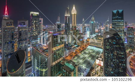Skyline view of the high-rise buildings on Sheikh Zayed Road in Dubai aerial all night timelapse, UAE. 105102296