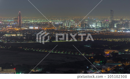 Bur Dubai and Deira districts aerial night timelapse viewed from financial district. Bur Dubai and Deira districts aerial night timelapse viewed from financial district. 105102308
