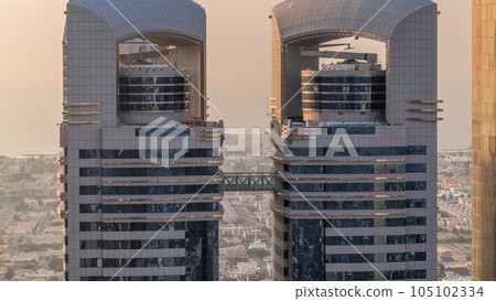 Close up view of the high-rise buildings on Sheikh Zayed Road in Dubai aerial timelapse, UAE. Close up view of the high-rise buildings on Sheikh Zayed Road in Dubai aerial timelapse, UAE. 105102334