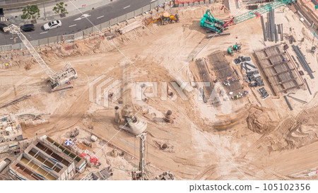 Aerial view construction site with a foundation pit of new skyscraper timelapse. Aerial view construction site with a foundation pit of new skyscraper timelapse. 105102356