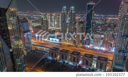 High-rise buildings on Sheikh Zayed Road in Dubai aerial night timelapse, UAE. 105102377