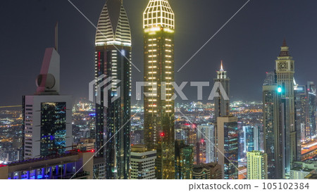 Skyline view of the high-rise buildings on Sheikh Zayed Road in Dubai aerial all night timelapse, UAE. Skyline view of the high-rise buildings on Sheikh Zayed Road in Dubai aerial all night timelapse, UAE. 105102384