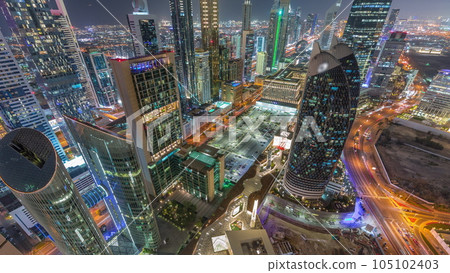 Skyline view of the high-rise buildings on Sheikh Zayed Road in Dubai aerial night timelapse, UAE. Skyline view of the high-rise buildings on Sheikh Zayed Road in Dubai aerial night timelapse, UAE. 105102403
