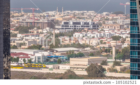 Aerial view to Dubai City Walk district timelapse from above 105102521