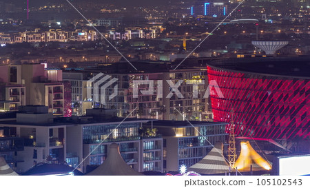 Aerial view to Dubai City Walk district night timelapse from above 105102543
