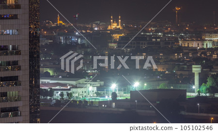 Aerial view to Dubai City Walk district night timelapse from above 105102546
