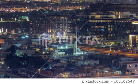 Aerial view to Dubai City Walk district night timelapse from above 105102547