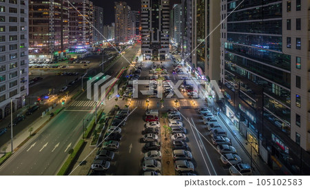 Residential buildings and modern city architecture of Abu Dhabi aerial timelapse during all night, UAE. 105102583
