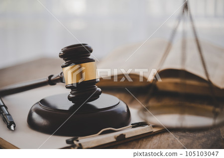 Law theme, mallet of the judge, law enforcement officers, evidence-based cases and documents taken into account. Law theme, mallet of the judge, law enforcement officers, evidence-based cases and documents taken into account. 105103047