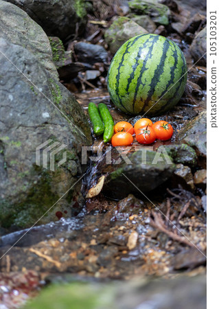Cooling watermelons, cucumbers and tomatoes in the mountain stream after visiting the river Cooling watermelons, cucumbers and tomatoes in the mountain stream after visiting the river 105103201