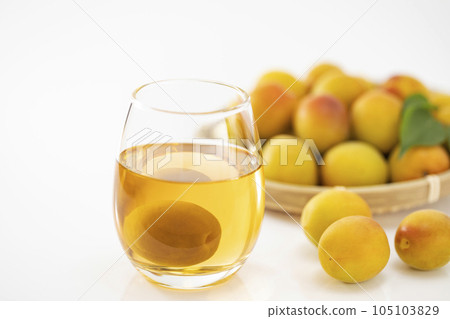 Plum wine poured into a glass with a white background 105103829