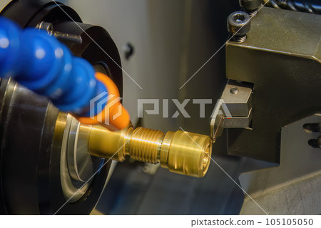 Close up scene the CNC lathe machine thread cutting at the end of brass pipe coupling parts. 105105050