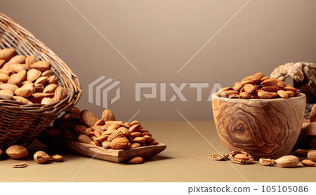 Almond nuts on a brown background. 105105086