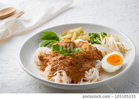 Rice noodles in fish curry sauce with meatball and vegetable (Kanom Jeen Nam Ya) 105105233