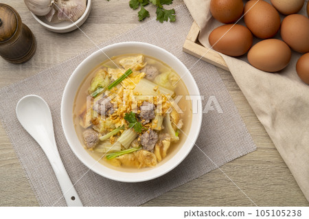 Clear soup with fried egg and minced pork ,Chinese Cabbage in white bowl.Top view Clear soup with fried egg and minced pork ,Chinese Cabbage in white bowl.Top view 105105238
