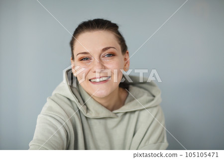 Beautiful portrait of young happy cheerful woman in casual sweatshirt 105105471
