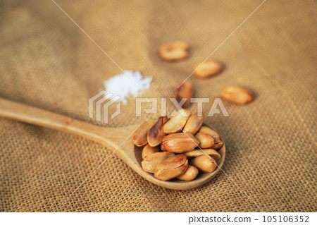 Yellow roasted groundnut on sack for healthy food eating or being in cooking ingredient. selective focus. 105106352