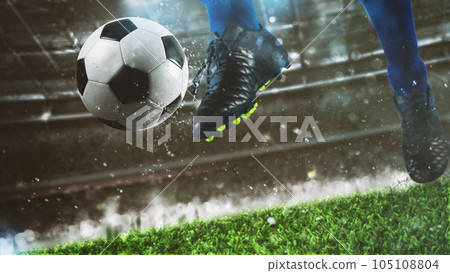 Football scene at night match with close up of a soccer shoe hitting the ball with power Football scene at night match with close up of a soccer shoe hitting the ball with power 105108804