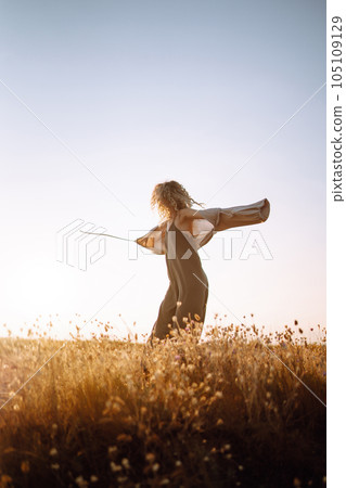 Young woman resting in nature. People, lifestyle, relaxation and vacations concept. Fashion. Young woman resting in nature. People, lifestyle, relaxation and vacations concept. Fashion. 105109129