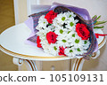 A beautiful luxurious bouquet of mixed flowers lies on the table. Wedding bouquet. Working as a florist in a flower shop 105109131