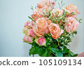A beautiful luxurious bouquet of mixed flowers lies on the table. Wedding bouquet. Working as a florist in a flower shop 105109134