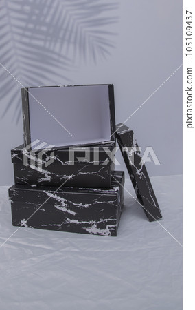 Blank black cardboard boxes for good and gifts. boxes for packaging goods from stores.festive packages 105109437