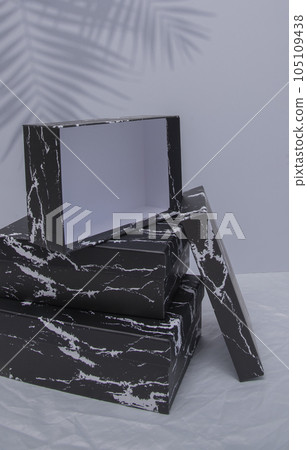 Blank black cardboard boxes for good and gifts. boxes for packaging goods from stores.festive packages 105109438