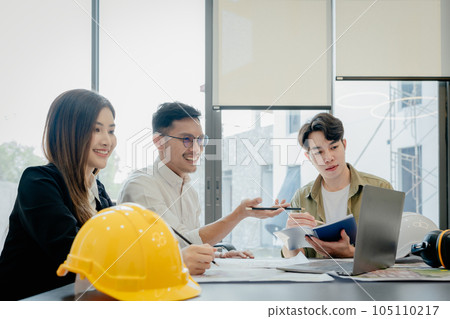 Engineers, designers and interior designers are finalizing the design of interiors by discussing selecting materials and colors to design rooms to present to clients 105110217