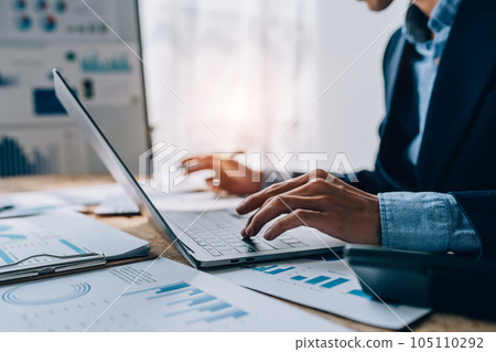 Young asian male work with financial papers at home count on calculator before paying taxes receipts online, planning budget glad to find chance for economy saving money, audit concepts Young asian male work with financial papers at home count on calculator before paying taxes receipts online, planning budget glad to find chance for economy saving money, audit concepts 105110292