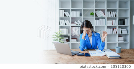 Portrait of business owner, woman using computer and financial statements Anxious expression on expanding the market to increase the ability to invest in business. Portrait of business owner, woman using computer and financial statements Anxious expression on expanding the market to increase the ability to invest in business. 105110300