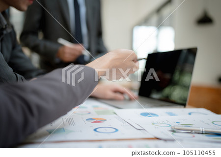 startup business, business advisor explaining strategy for planning finance investment teamwork paperwork audit and discussing marketing, profit, budget of company in meeting room 105110455