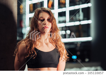 Athletic Beautiful Woman at gym.  105110857