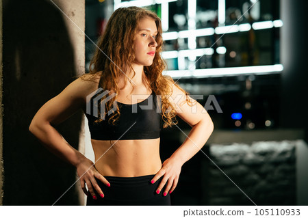 Athletic Beautiful Woman at gym.  105110933