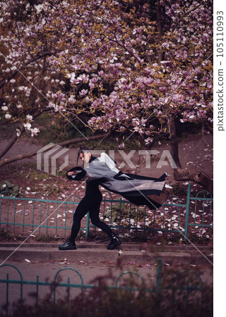 Beautiful young woman wearing kimono with cherry blossoms, sakura view Beautiful young woman wearing kimono with cherry blossoms, sakura view 105110993