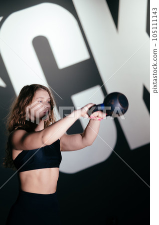 Athletic Beautiful Woman Does her cross fitness at gym Athletic Beautiful Woman Does her cross fitness at gym 105111143