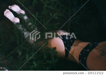 Back view of Young woman in bikini bathing in hot tub at mountains during winter. Concept of rest and recovery in hot vat on nature. Idea of escape and recreation on mountains Back view of Young woman in bikini bathing in hot tub at mountains during winter. Concept of rest and recovery in hot vat on nature. Idea of escape and recreation on mountains 105111522