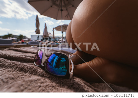 close up portrait back view of beautiful girl in bikini on the beach 105111715