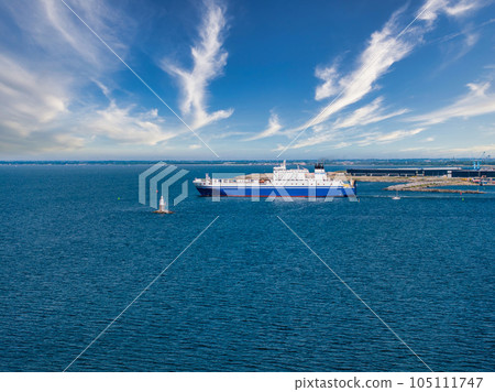 Industrial ship crossing the canal moving towards Malmo bridge between Sweden and Denmark. 105111747