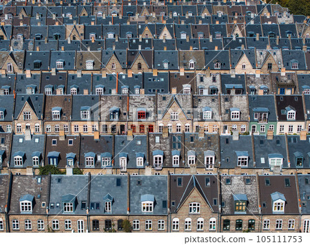 Aerial view of the rooftops of Kartoffelraekkerne neighborhood, in Oesterbro, Copenhagen, Denmark. The neighbourhood built in the late 1800s for working class families Aerial view of the rooftops of Kartoffelraekkerne neighborhood, in Oesterbro, Copenhagen, Denmark. The neighbourhood built in the late 1800s for working class families 105111753