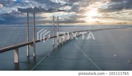 Panoramic aerial close up view of Oresund bridge over the Baltic sea between Malmo city in Sweden and Copenhagen in Denmark. Panoramic aerial close up view of Oresund bridge over the Baltic sea between Malmo city in Sweden and Copenhagen in Denmark. 105111765