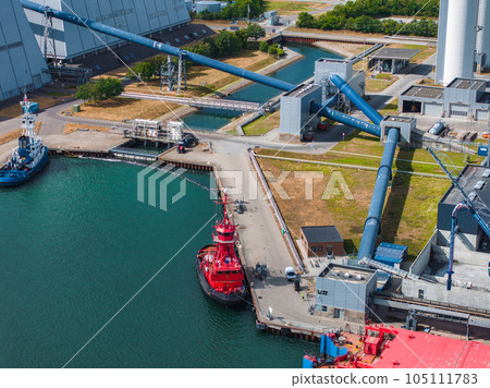 Coal factory in Copenhagen, Denmark. Ships bringing coal to the electrical power plant. 105111783