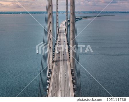 Panoramic aerial close up view of Oresund bridge over the Baltic sea between Malmo city in Sweden and Copenhagen in Denmark. 105111786