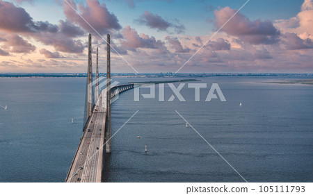 Panoramic aerial close up view of Oresund bridge over the Baltic sea between Malmo city in Sweden and Copenhagen in Denmark. 105111793