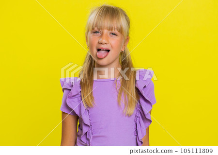 Cheerful funny bully child girl showing tongue making silly faces, fooling around, joking, teasing Cheerful funny bully child girl showing tongue making silly faces, fooling around, joking, teasing 105111809